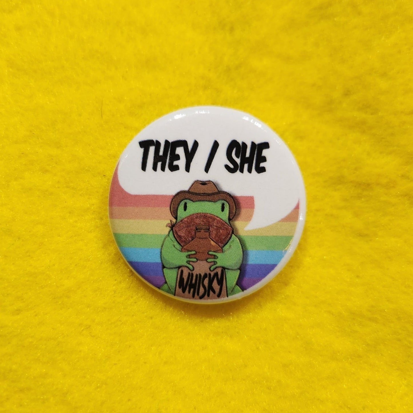 Whisky Frog Pronoun Button | THEY/SHE | 1.25" - Deviantkreations